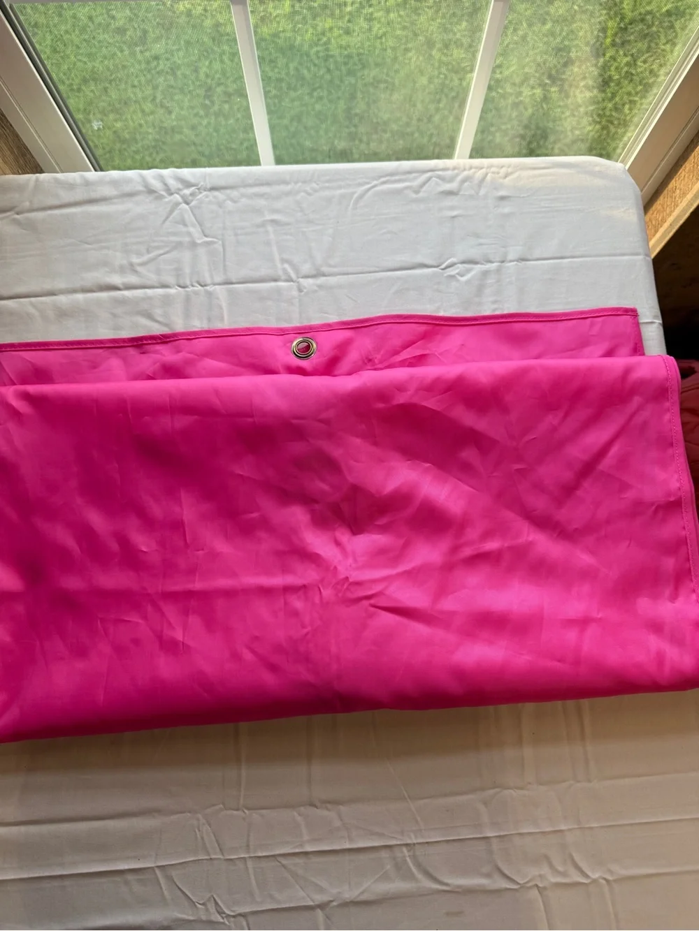 kate spade hot pink garment bag with gold logo